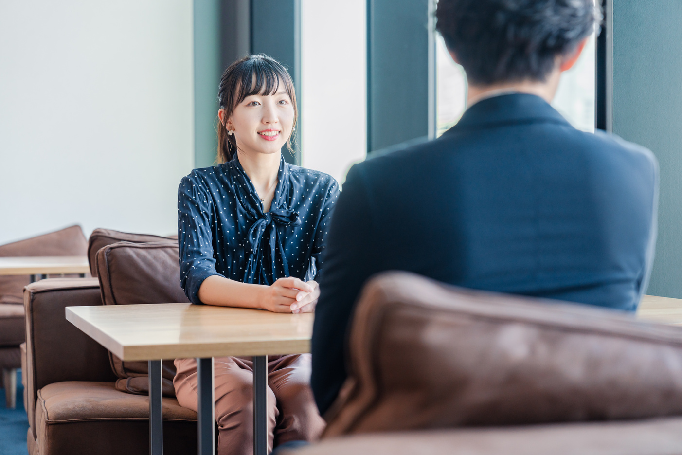 Businesswoman having a 1-on-1 meeting with her boss